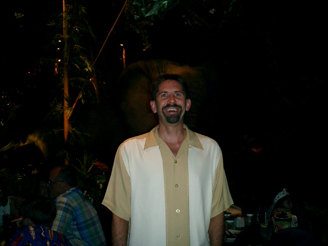 Rex standing in the dark.