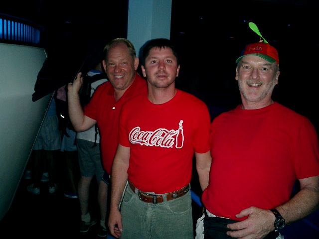 John, Jody, and Randy pose in red shirts.