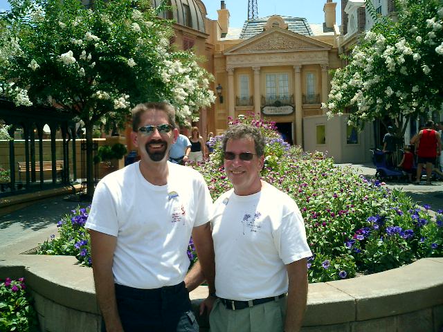 Rex and Steve say goodbye to Disney for 2004 in front of the beautiful flowers of France.
