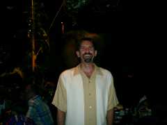 Rex standing in the dark. Click to display the image.