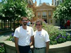 Rex and Steve say goodbye to Disney for 2004 in front of the beautiful flowers of France. Click to display the image.
