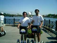 rex and steve on Segway overlooking main Epcot sphere Click to display the image.