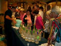 All the lushes on the ship lining up for a free sample taste of cheap, nasty rum. Click to display the image.
