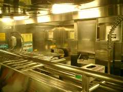 I took a tour of the galley for the first time in all our cruising experience. The most interesting thing for me was that the last thing the waiter sees before heading out to the dining room is ice chests. Click to display the image.